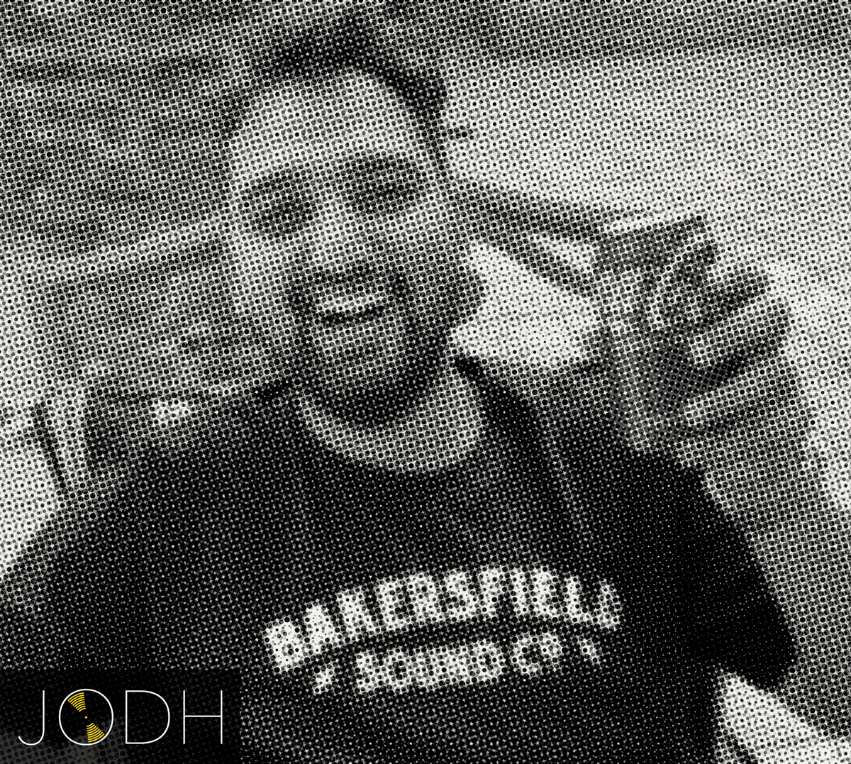 A person sitting at a desk in front of a computer